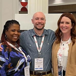 Christopher shown with two co-workers. 