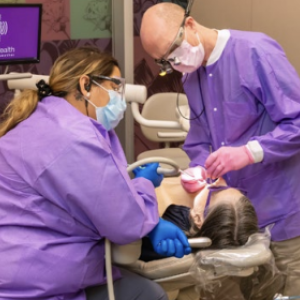 Health care professionals helping a patient 