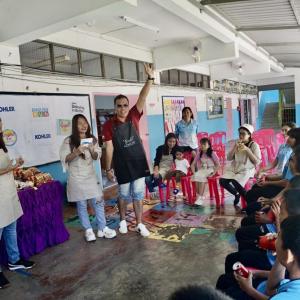 Teachers in front of class of students