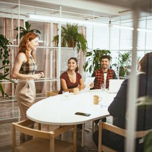 group of 4 sitting listening to a speaker
