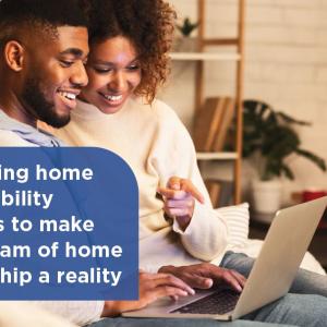 Man and woman smiling in front of computer with text overlaid that says, "Removing home affordability barriers to make the dream of home ownership a reality"