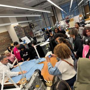 Students gathered around a table at Career Discovery Week at Tapestry HQ