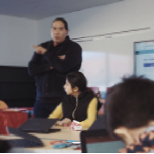 Teacher at the front of the classroom