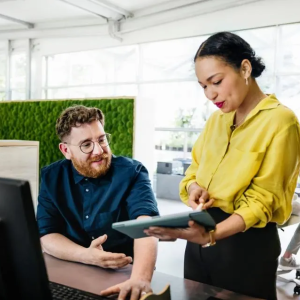 2 people look at a screen together