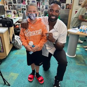 Colton Hall, 9, who was diagnosed with leukemia, gets a visit from former NFL star Calvin Johnson at Aflac Cancer and Blood Disorders Center in Atlanta Sept. 1. Courtesy The Hall Family