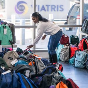 1 person among lots of back packs