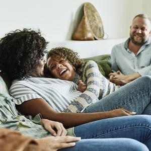 Group of four people seated on a couch.