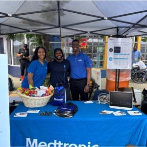 Image of Medtronic employees at an informational booth outdoors