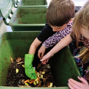kids working on composting