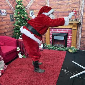 Santa waving at large screen