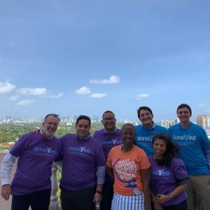 Group of employees wearing "Involved" T-shirts 