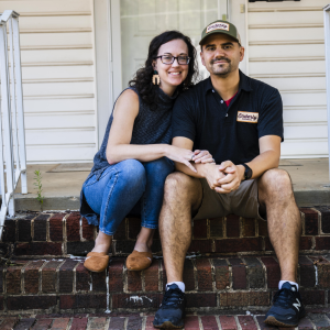 The santoros on a brick porch.