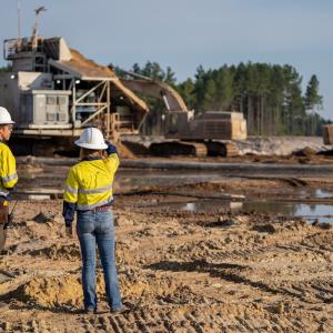 people looking onto a worksite