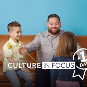 NRG Culture in Focus: Number 1 Dad. Father shown with his two children.
