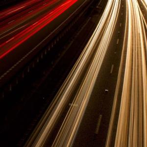 long exposure image of aerial shot of highway traffic 