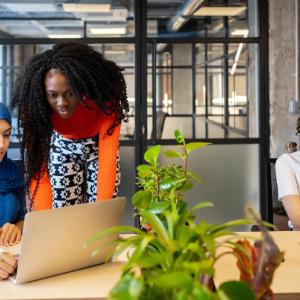 diverse women working on laptops