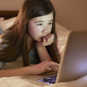child looking at laptop computer screen
