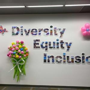 Wall display with the words "Diversity Equity Inclusion" made out of photos