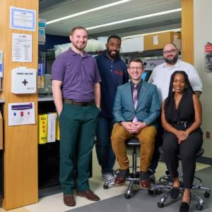 The NGS Core, from left to right: Dr. Joel Steyer, Bioinformatician; Ikenna Uzomah, Medical Technologist; Dr. Eric Vaughn, DrPH, NGS Supervisor; Wadih Bchara, Lead Sequencing Technologist; Taylor Boyd, Medical Technologist | Photo: Noah Willman