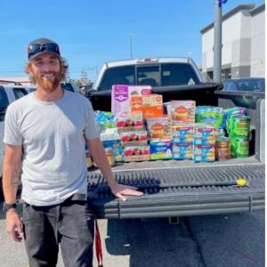 Mike Ash with a truck full of food to donate to shelters in Detroit.
