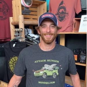 Mike Ash wearing Attack Hunger Moosejaw t-shirt.