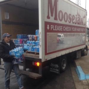 Moosejaw truck being loaded up with water to distribute to shelters.