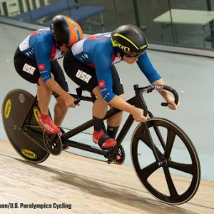 MK Wintz, front, pilots a tandem bike ahead of riding partner Hannah Chadwick, who is visually impaired and rides in the back “stroker” position. MK, who does not have a physical impairment, helps guide the bike through the track.
