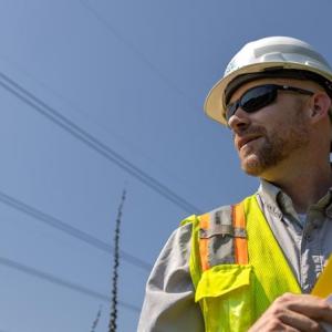 Will Ricks wearing a safety hat and hi-viz