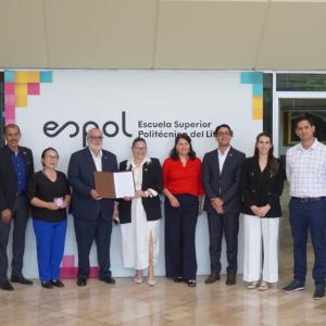 Representatives from DP World and ESPOL pose for a group photo following the signing of a partnership agreement to monitor marine biodiversity at the Port of Posorja.