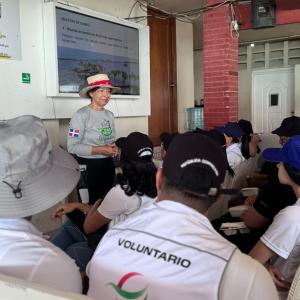Fundación Verde Profundo representative speaks to DP World employees during a mangrove conservation education session in Boca Chica.