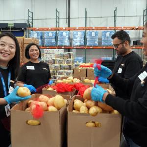Volunteers assembled five-pound bags of fruits and vegetables.