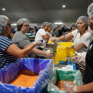 AEG employees volunteered their time to help pack meals on 9/11 Day.