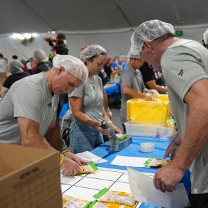 LA Kings Darryl Evans joins volunteers to pack meals on 9/11 Day at L.A. LIVE.