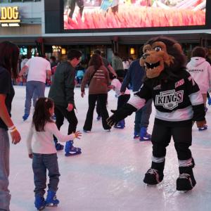 LA Kings mascot Bailey helped children skate at the LA Kings Holiday Ice rink during a community holiday celebration.