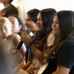Girls Inc. of Los Angeles participant asks a question during an interactive discussion session focused on leadership, personal growth, and career exploration.