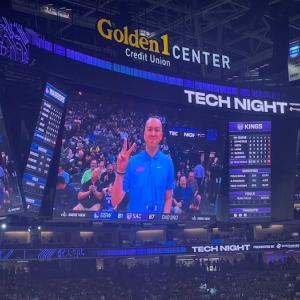 Tom Tran being honored by the Sacramento Kings. Shown on a video monitor at a game.