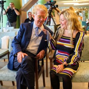 Dan and Elaina shown as older people. Elaina is holding Dan's tie as she did when she was a child.