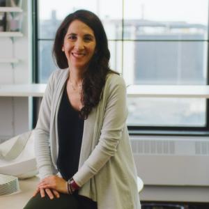 Woman sitting and smiling