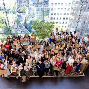 Group of men and women looking up at a photographer 