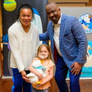 South Carolina women’s basketball head coach Dawn Staley and Aflac U.S. President Virgil Miller deliver My Special Aflac Duck to cancer and sickle cell disease patients at UVA Children's in Charlottesville, Virginia.
