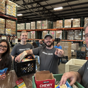 Wesco volunteers packing food donations.