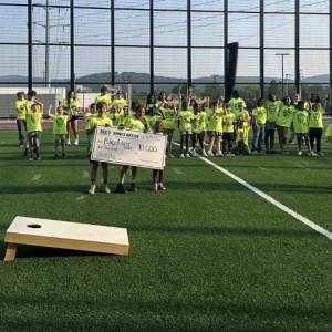 Day of Play participants shown with the grant checks from DICK'S.