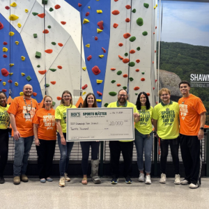 Team shown with the $20,000 grant check.