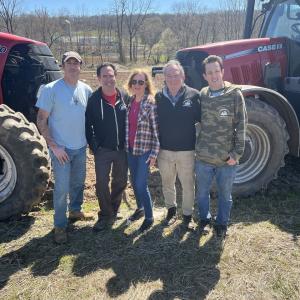 Group photo in front of two tractors at De Francesco Farm