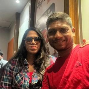 Deepthi and her husband shown in a restaurant.