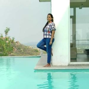 Deepthi shown at a swimming pool.