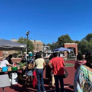 People lined up at the Delavan-Grider Farmers market to buy fresh produce.