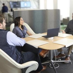 Demarcus Reaves in a meeting with two others.