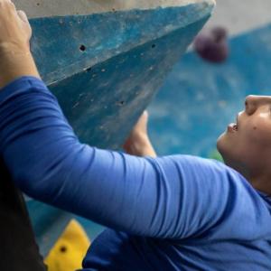 Alexandra Toth climbing a rock wall