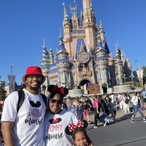 Dexter Thompson and family, a Disney castle in the background.